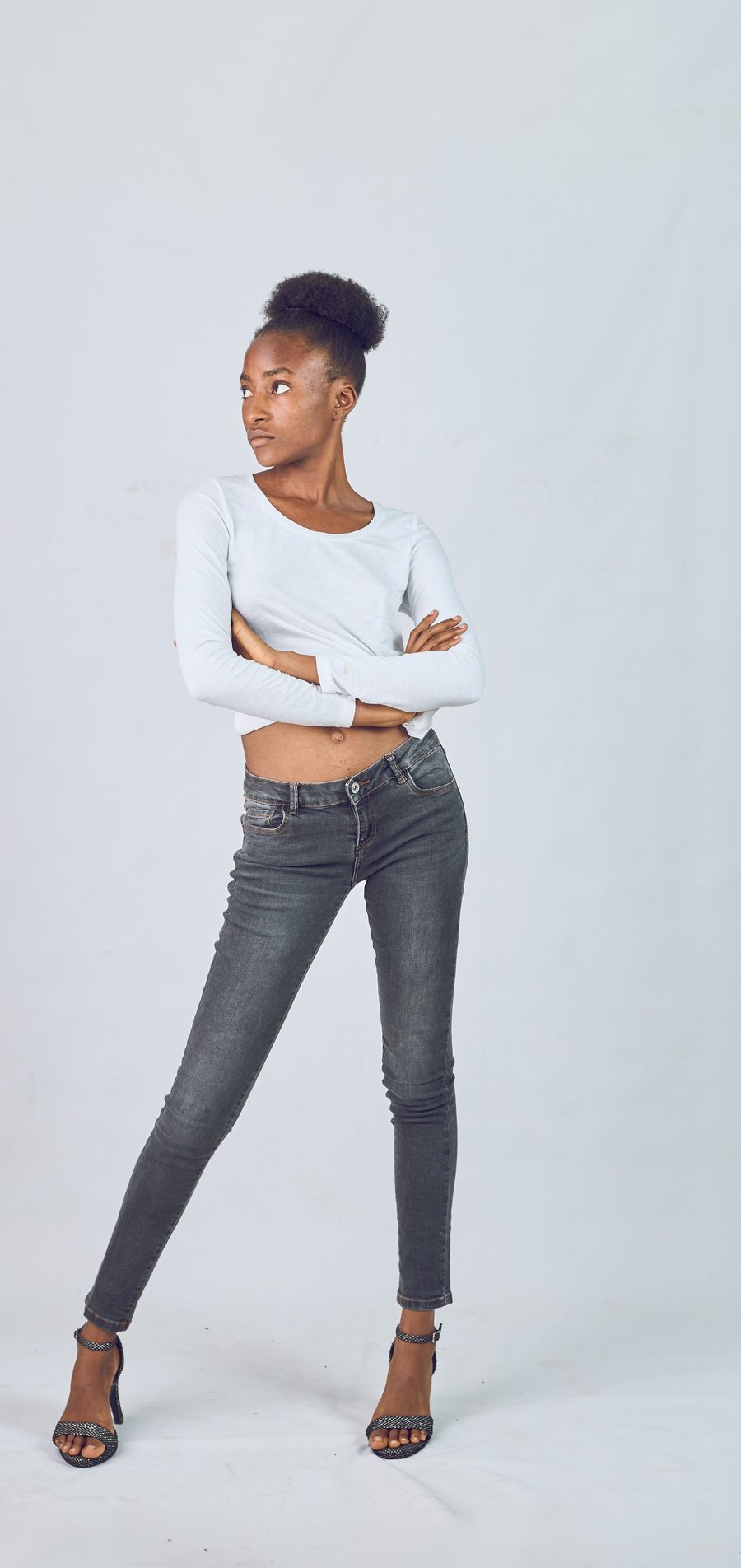 Model posing on a studio backdrop